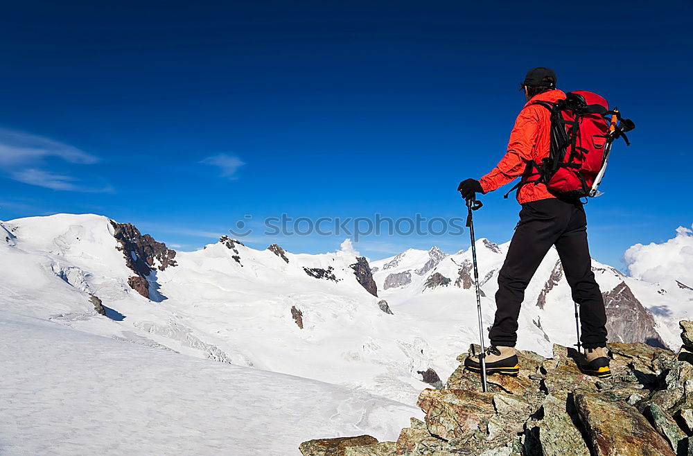 Similar – Image, Stock Photo Mountaineer faces a climb at the top of a snowy peak.