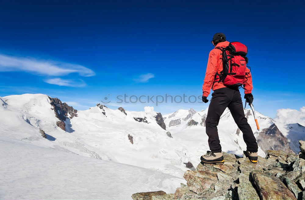 Similar – Image, Stock Photo Mountaineer reaches the top of a snowy mountain