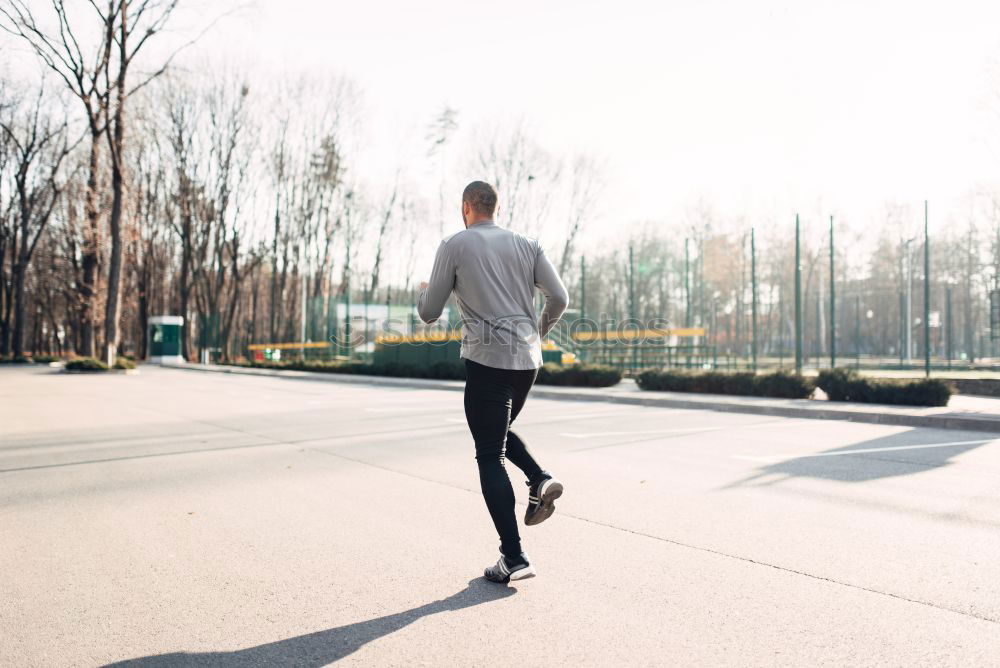 Similar – Rear view of black man running in urban background.