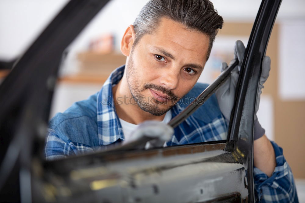 Similar – Image, Stock Photo Mechanic checking wheel of a customized motorcycle