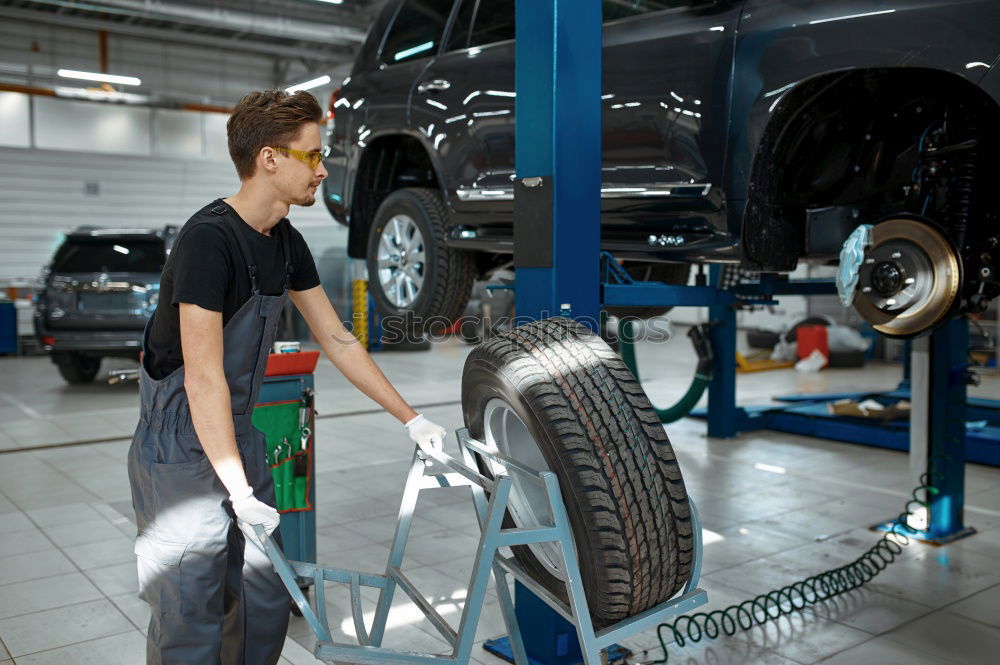 Similar – Professional Car Mechanic working.