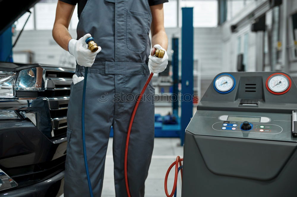 Similar – Professional Mechanic Repairing Car Engine.