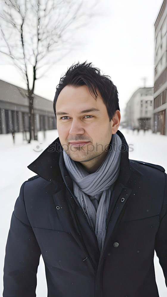 Young handsome confident fashionable man standing in an urban street