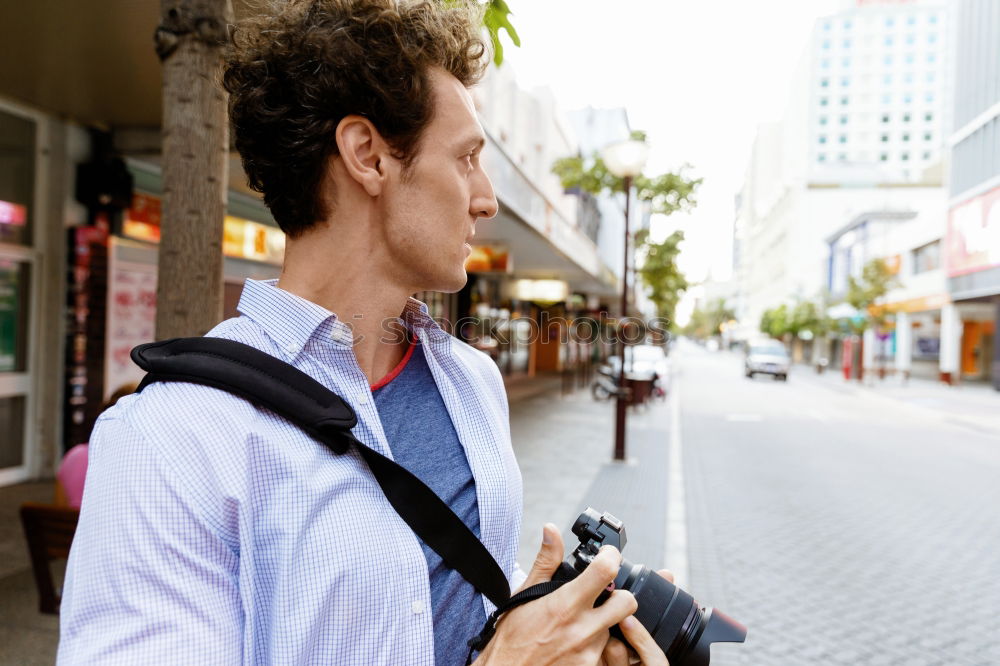 Similar – Traveler using smartphone on city