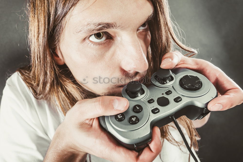 Similar – Young nerd playing video games