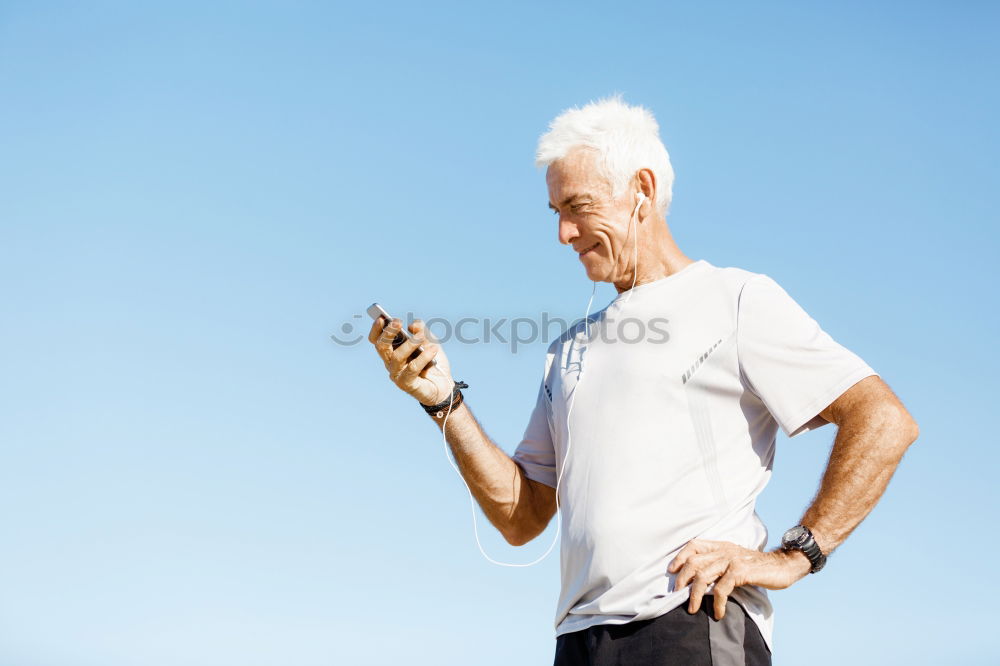 Similar – Senior runner man sitting after jogging in a park