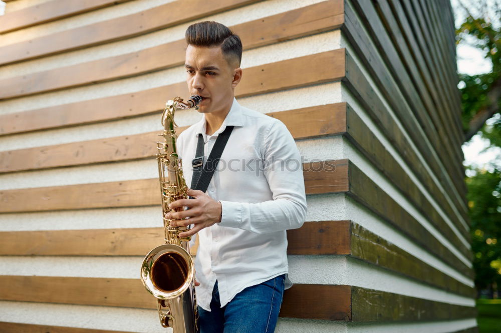 Similar – Smiling jazzman with sax