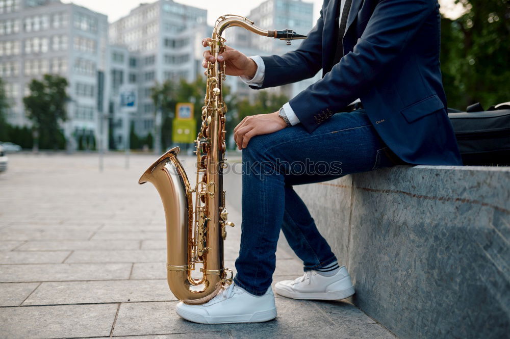 Similar – Smiling jazzman with sax