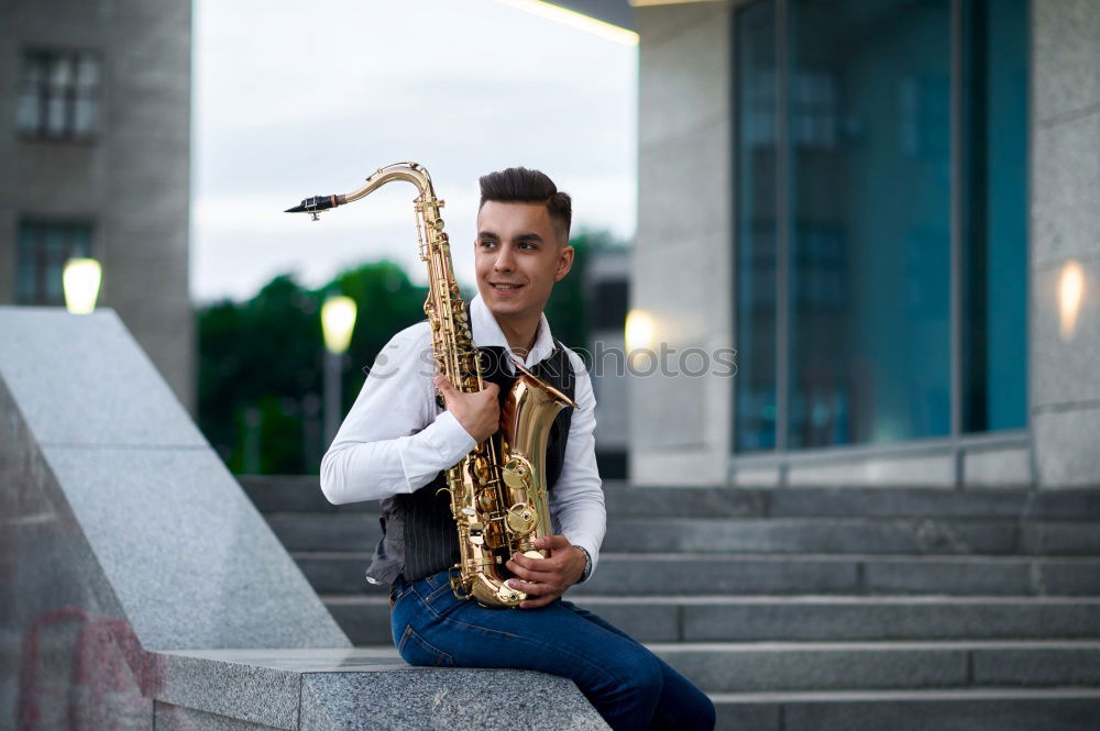 Similar – Smiling jazzman with sax