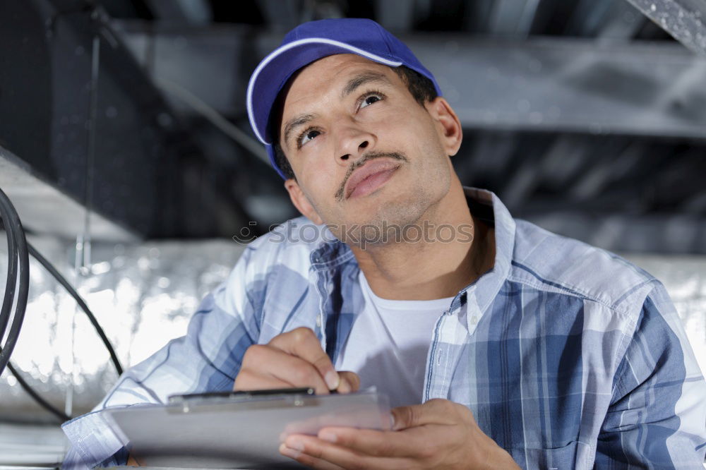 Similar – Image, Stock Photo Mechanic checking wheel of a customized motorcycle