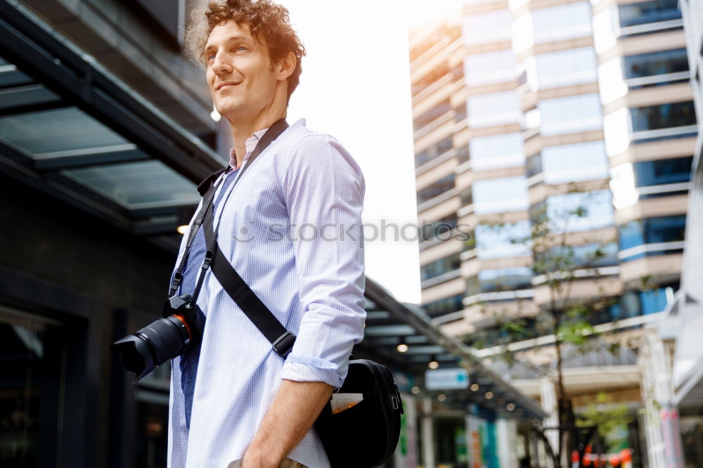 Similar – Young black man walking smiling down the street.