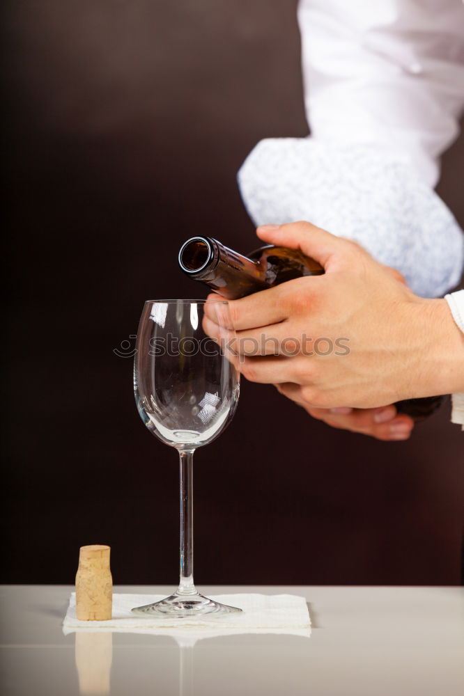 Barman is making cocktail at night club