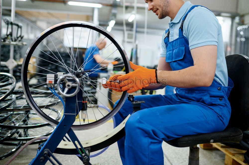 Similar – Image, Stock Photo female mechanic fixing a compressor enginge using a wrench