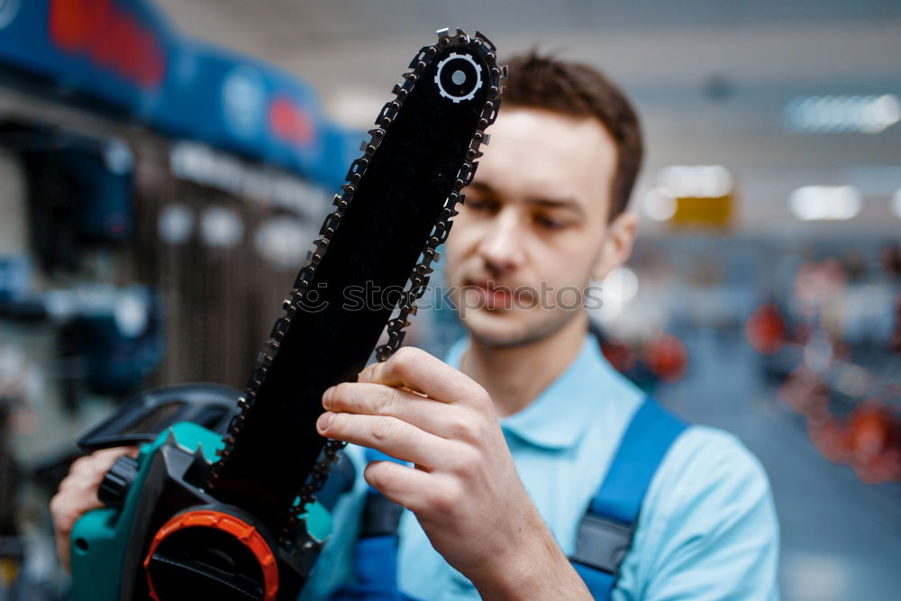 Similar – Professional Mechanic Repairing Car.