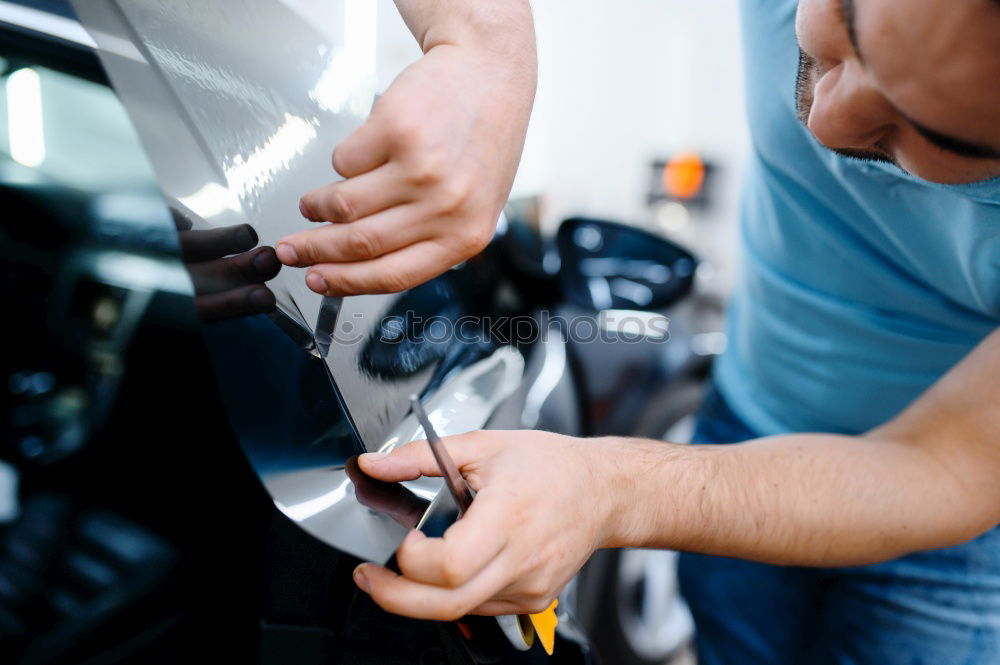 Similar – Motorcycle mechanic changing a fuse