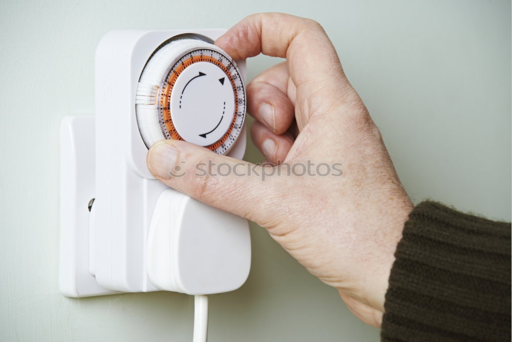 Similar – Image, Stock Photo One person turns up the heating to the highest level. Heating in winter.