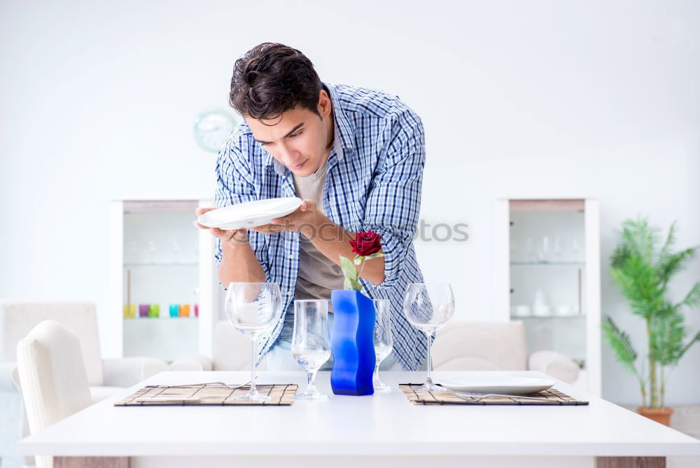 Similar – Image, Stock Photo Young female sitting by table and making clay or ceramic mug in her working studio