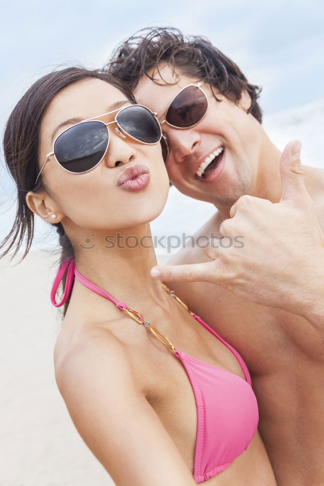 Similar – Close-up of young adult’s muscular bodies on the beach