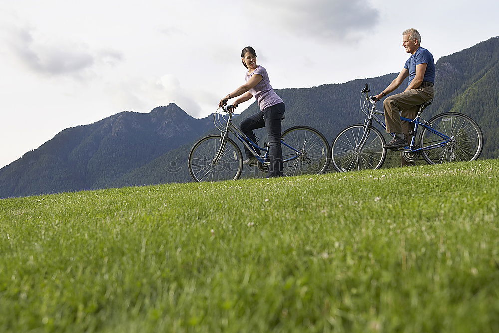 Similar – Image, Stock Photo Women with bikes browsing smartphone