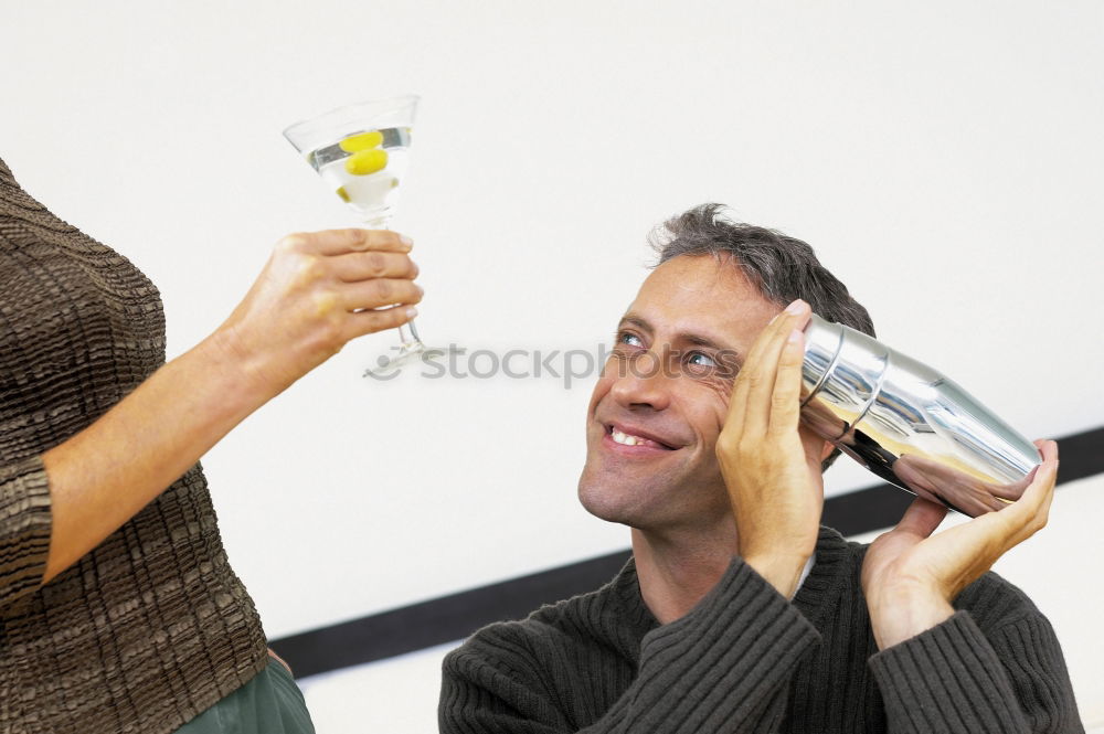 Similar – Image, Stock Photo Elegant young woman in a white dress drinking white wine at a function and smiling up at her male partner