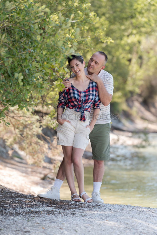 Similar – Image, Stock Photo Young smiling couple on a path in the park.