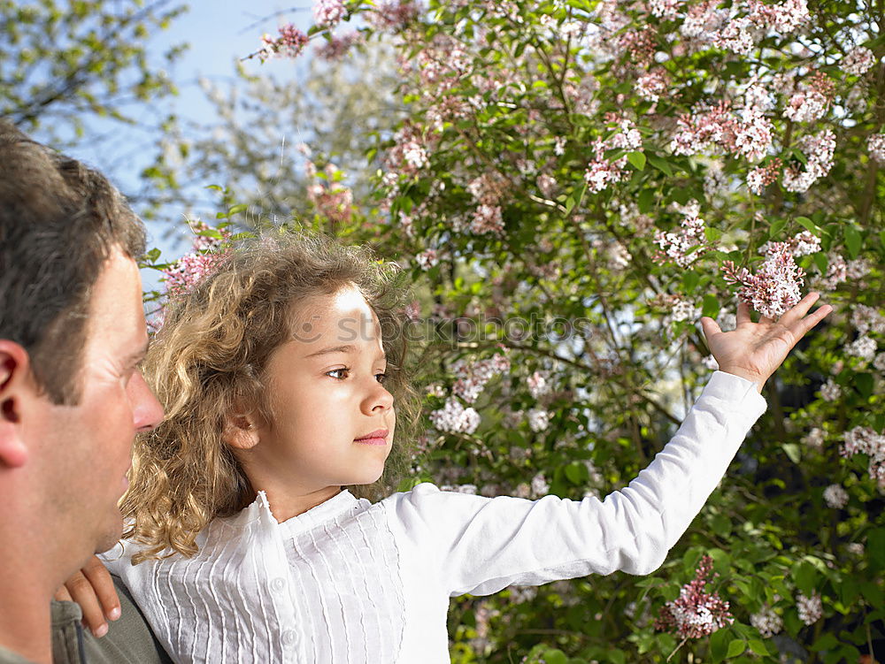 Similar – Image, Stock Photo Little baby is touching fresh spring leaves in her mother’s hug