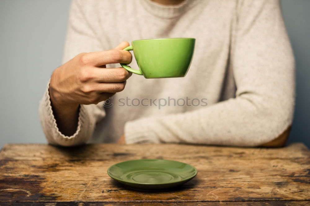 Similar – Happy young woman holding a cup of tea or coffee