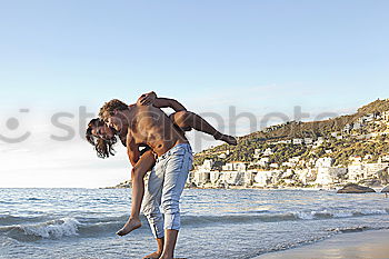 Similar – Image, Stock Photo Two adults training on the beach together