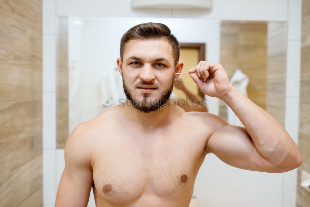 Similar – Friendly young man soaping himself in the shower