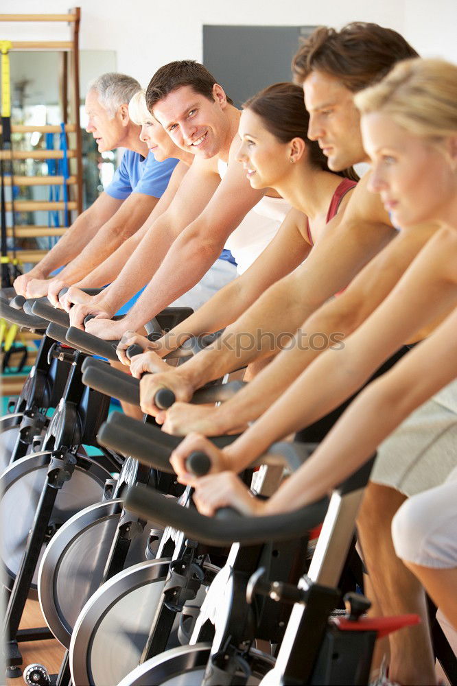 Similar – Concentrated woman in hard bike training session