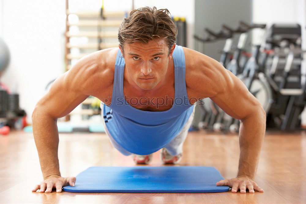 Similar – Image, Stock Photo Man stretching and woman doing dumbbells exercises in gym