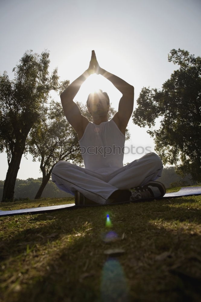 Man doing yoga in nature.