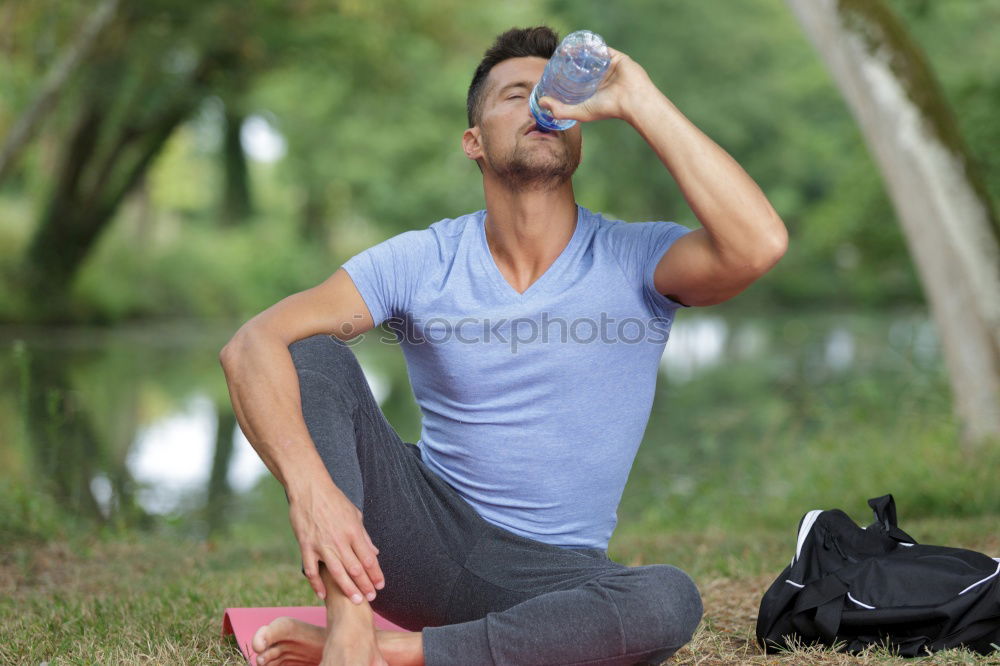 Similar – Young man drinking bottled water