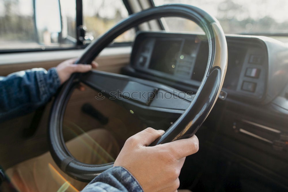 Image, Stock Photo Young man holding steering driving