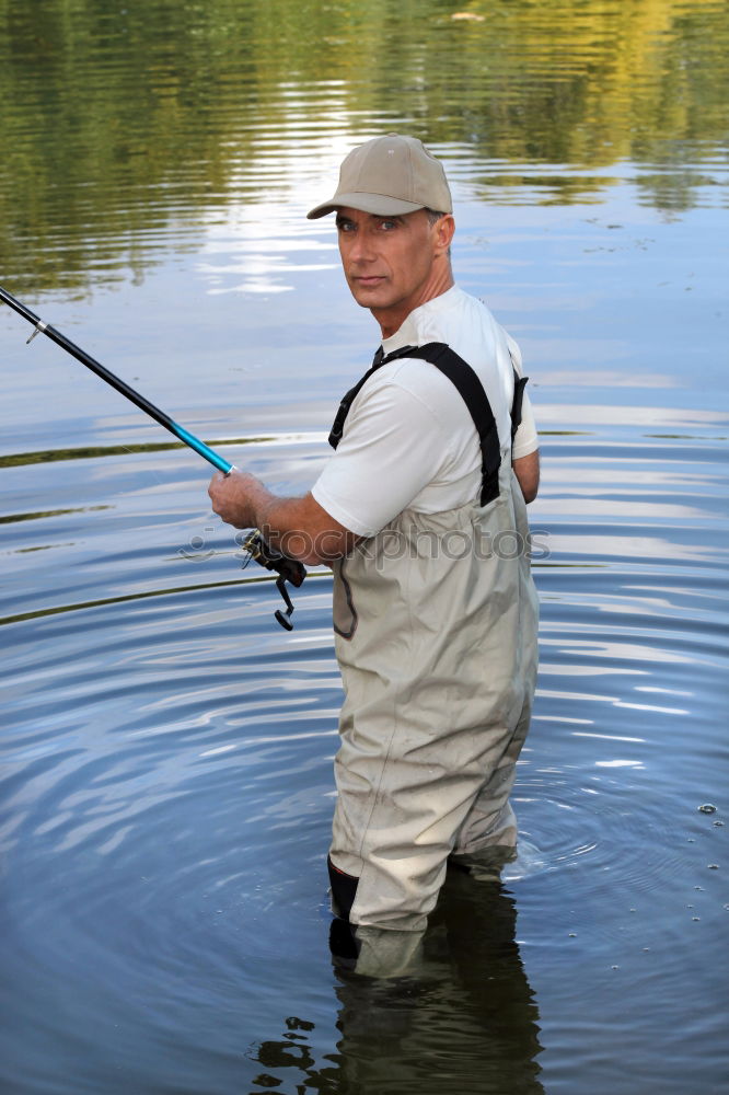 Similar – Fisherman caught a fish