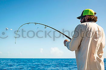 Similar – Man on fishing with rod