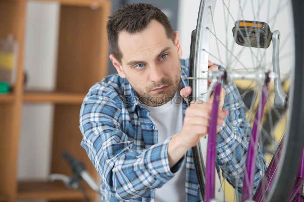 Similar – Man working on bike