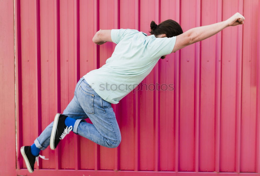 Similar – Image, Stock Photo Young black man wearing casual clothes jumping in urban background