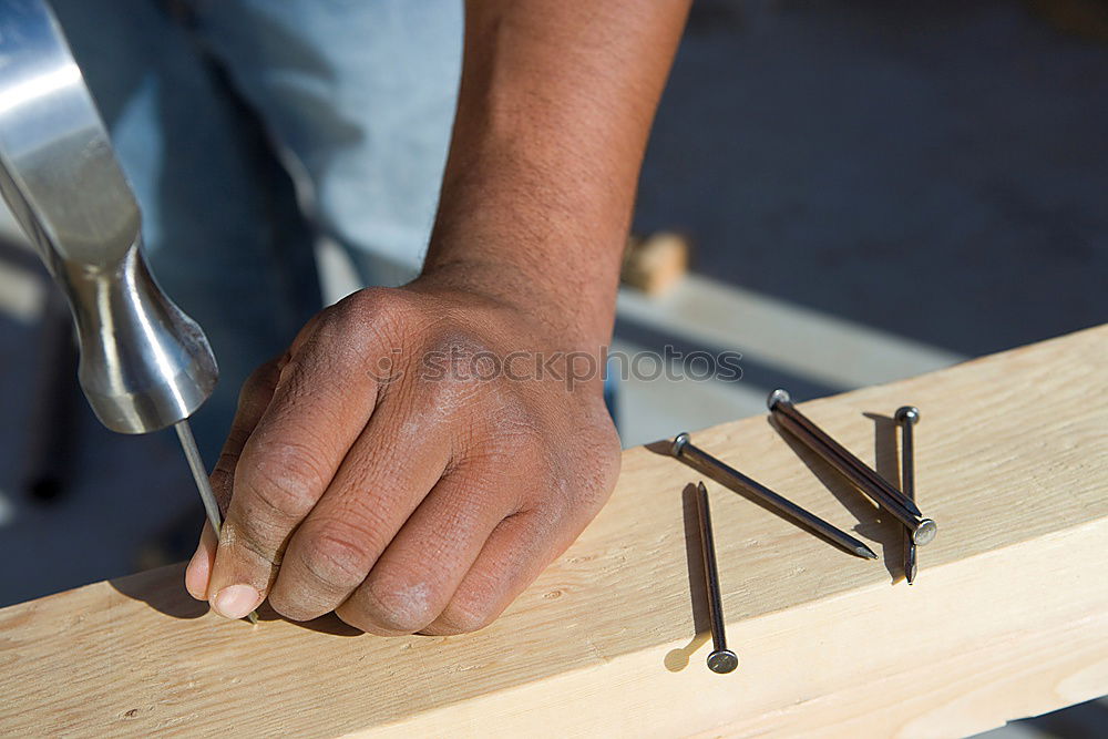 Similar – Carving stone, craftsman shaping stone