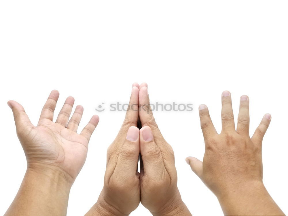 Similar – Together against racism // Three hands in different skin colours made of paper hold together