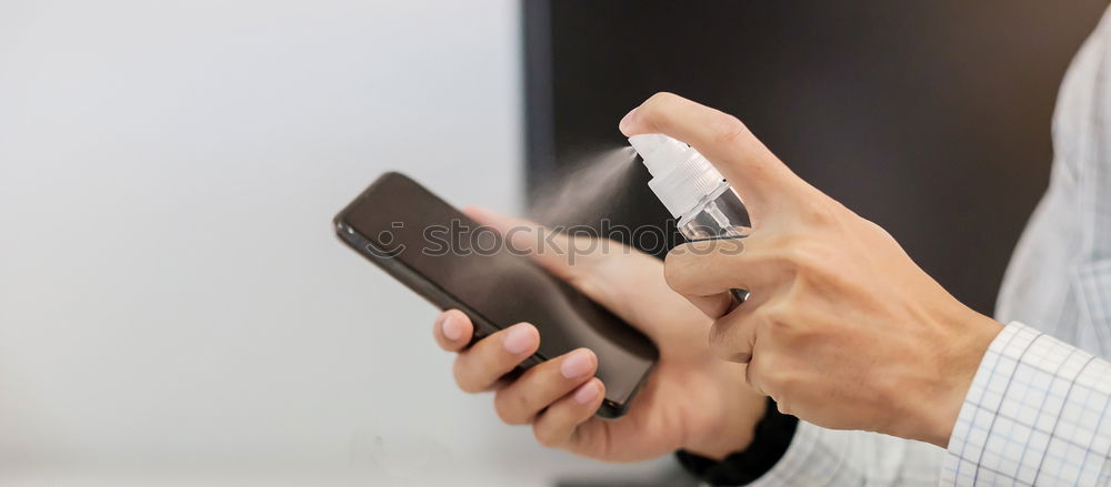 Similar – Woman hands using smartphone and writing notebook