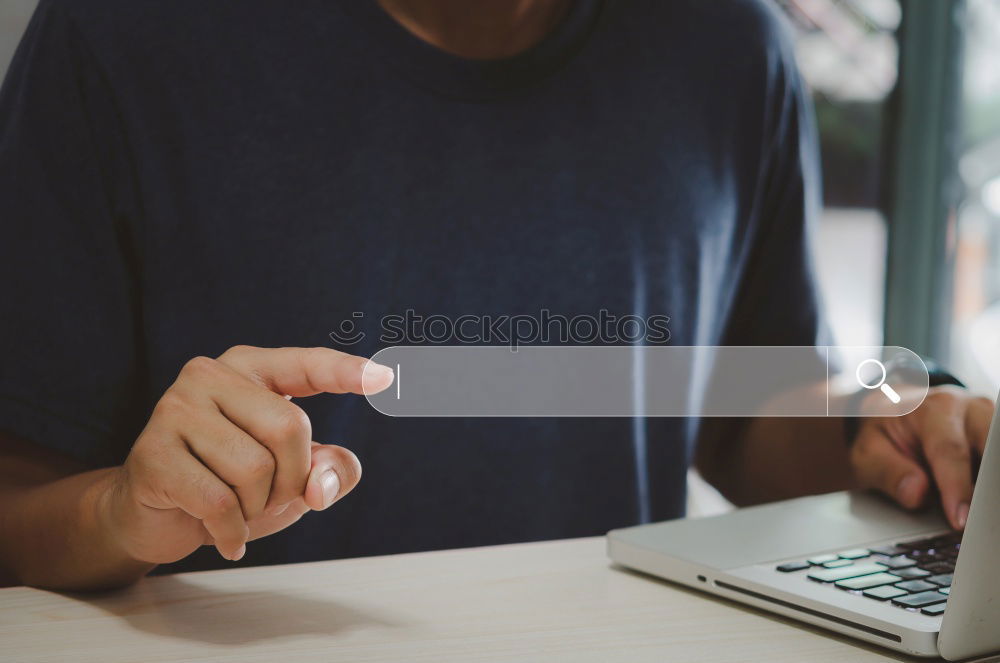 Close-up of women typing on keyboard on her laptop at home