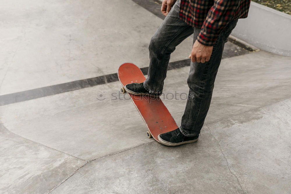 Similar – Man with tattoos holding skateboard at shore. Back view.