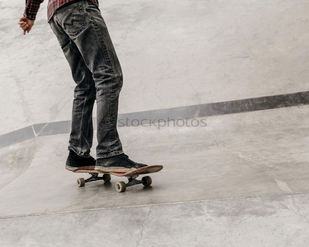 Similar – Man with tattoos holding skateboard at shore. Back view.