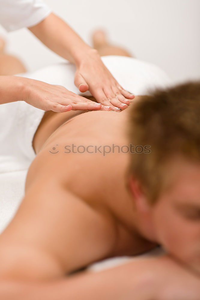 Similar – Young man having massage in spa