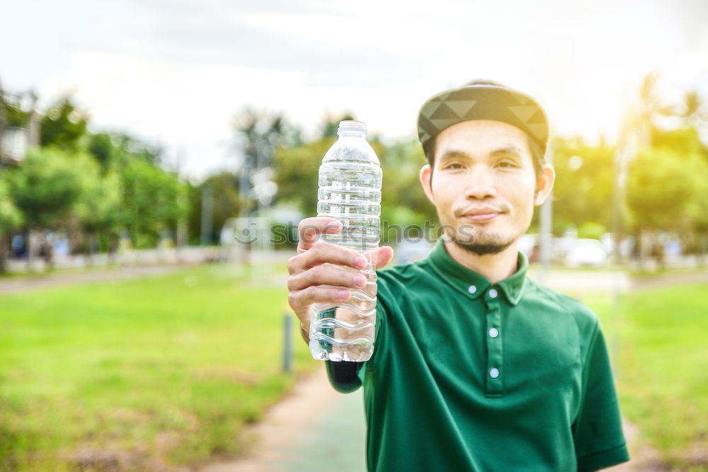 Similar – Image, Stock Photo Young bearded man drinking bottled water