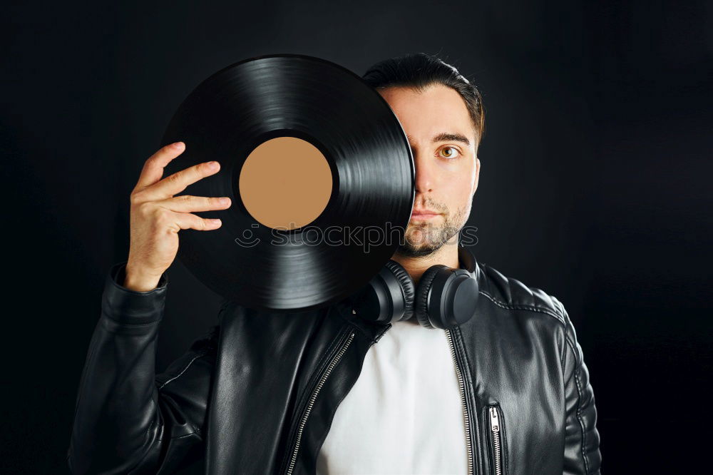 Similar – Image, Stock Photo Young handsome man over a dark brick wall