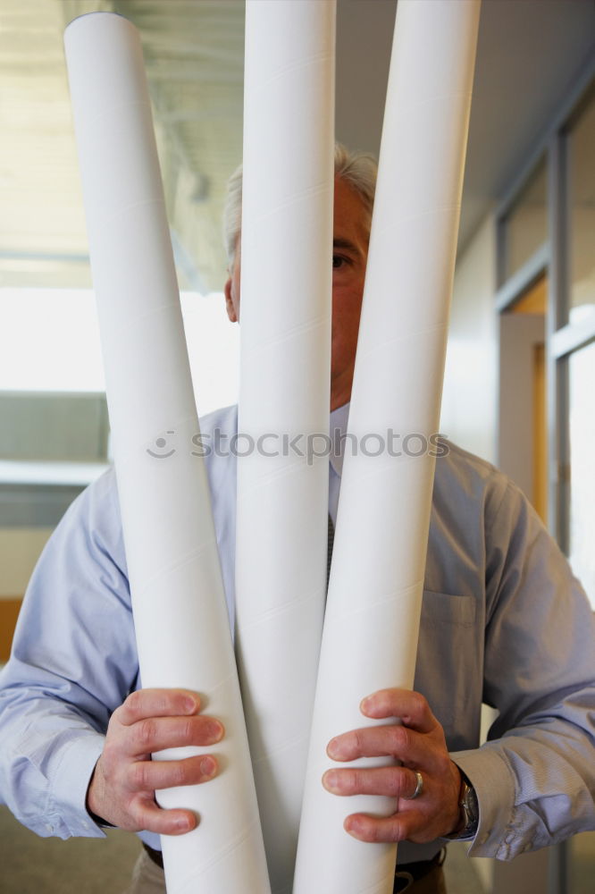 Image, Stock Photo Young man looks curiously over a barrier