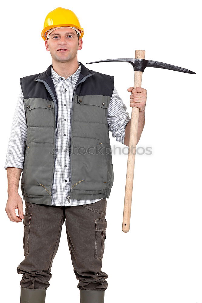 Similar – Worker man with hammer drill and building level at construction site