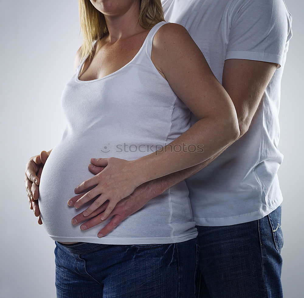 Similar – Image, Stock Photo Happy pregnant couple feeling the movements of their baby